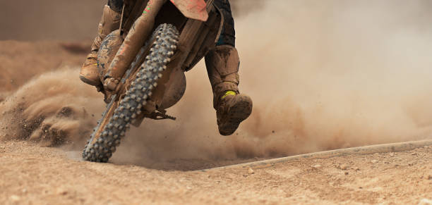 istock Motocross racer accelerating speed in track 1159339495
