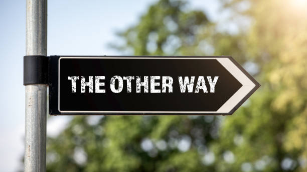 istock The other way concept for lost, confusion or decisions 1159341337