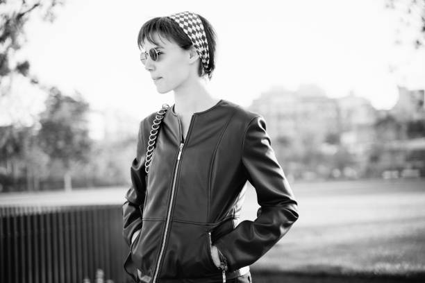 istock Young woman walking in a public park 1159343190