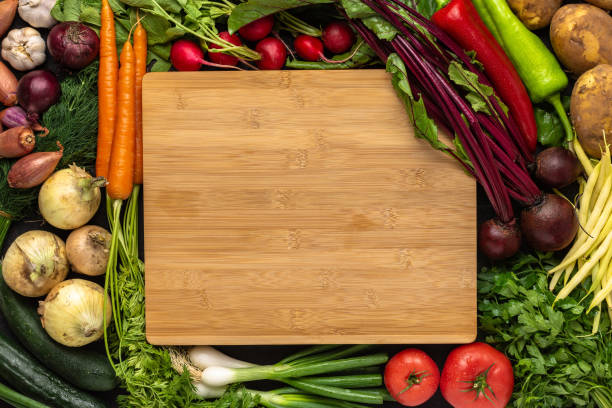 istock Empty Chopping Board with Fresh Vegetables Background. Healthy Eating Concept with Copy Space. 1159343275
