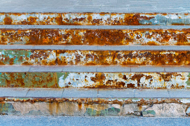 istock Old rusty steps in front of the building. 1159344275