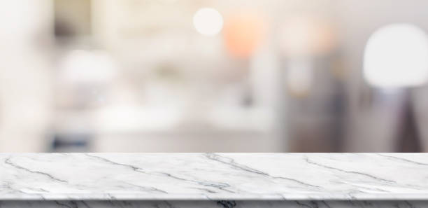 istock Empty white marble table top food stand with blur house kitchen background bokeh light,Mock up for product display or montage of design,Banner for advertise on online media. 1159345484
