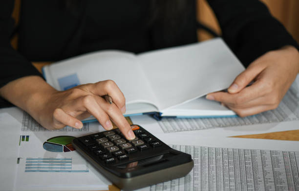 istock Accounting concept,Accounting staff is summarizing the company budget. 1159345919