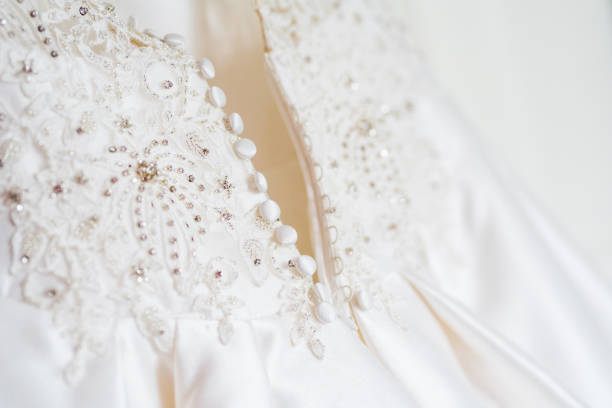 istock Beautiful wedding dress with crystals close up 1159346123