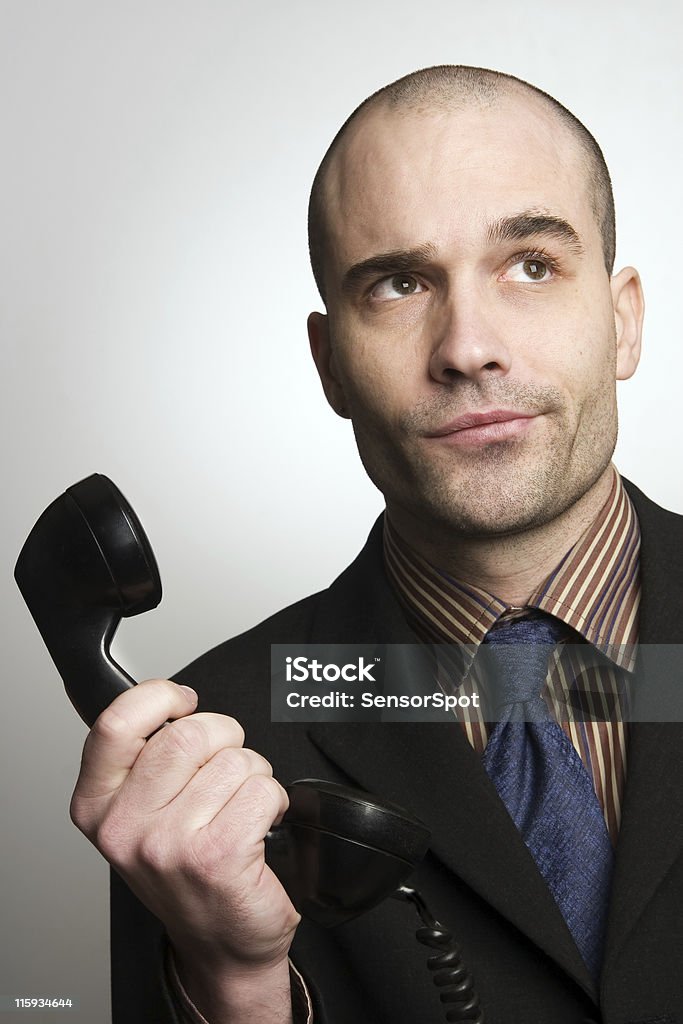 Bad news Young businessman receiving bad news at phone. Actor Stock Photo