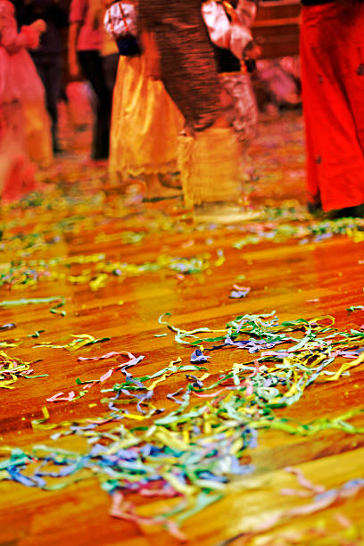 Party-time floor The floor of a room during a costume party, covered with confetti and curly ribbons. partytime stock pictures, royalty-free photos & images