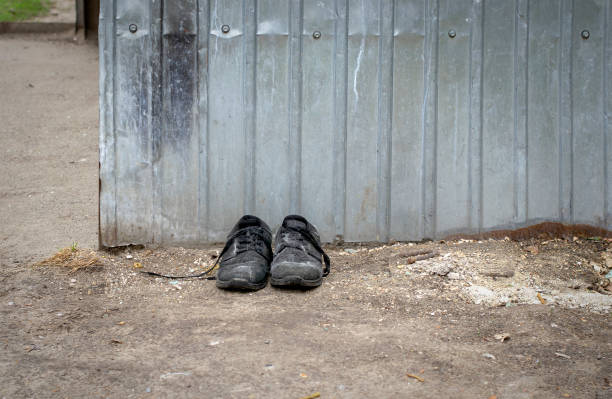 Pair of old man shoes on wooden floor from above