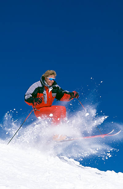 istock Snow Skier Jumping Over Mogul 115934854