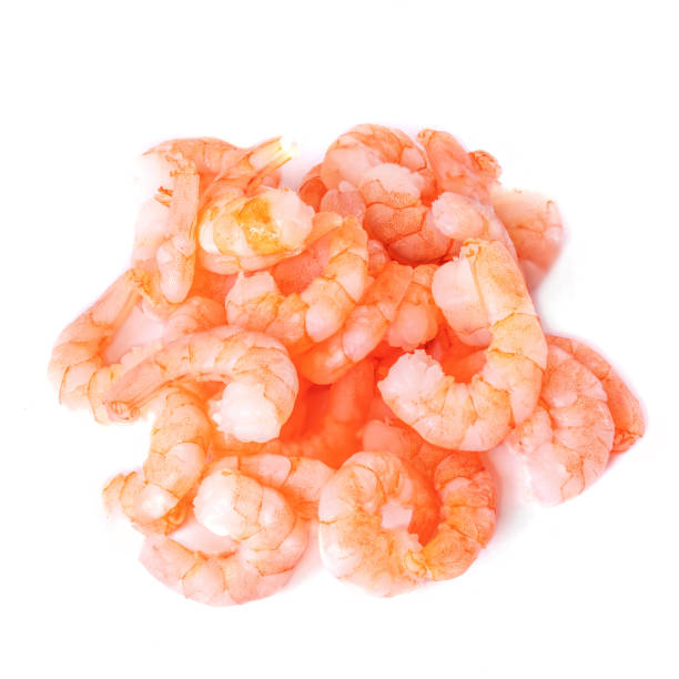 istock Peeled shrimps isolated on white background. Seafood concept. Top view 1159350179