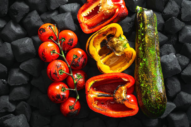 Cooked vegetables grilled over charcoal top view