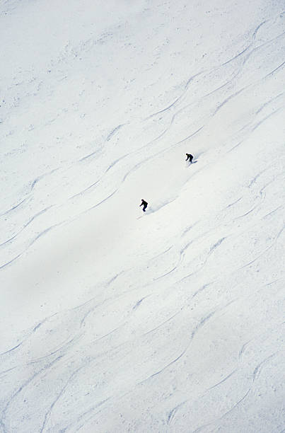 istock Two Snow Skiers Making Fresh Tracks 115935583
