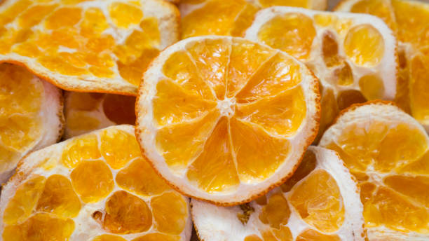 istock Background of dried orange slices 1159357841