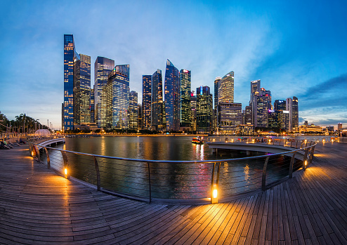 The colorful panorama of business building looking from walk way of Marina bay sands, Singapore