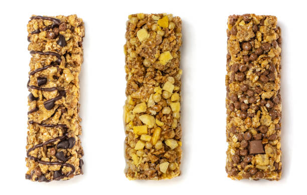 istock Three different granola bars with cereals and chocolate isolated on white background. Top view 1159361809