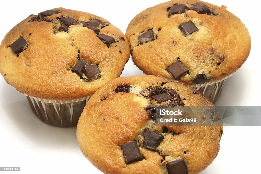 Chocolate Chip Muffins close up of three chocolate chip muffins on a white background Baked Stock Photo