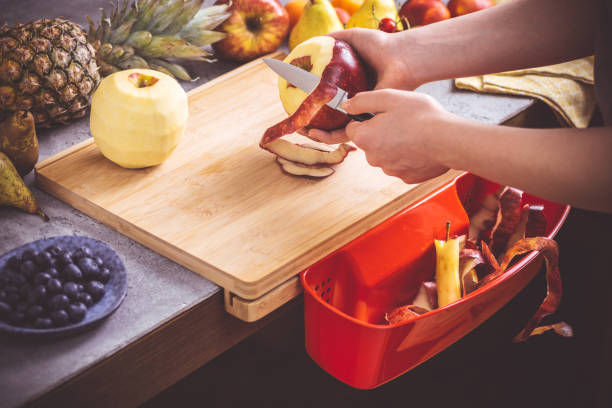 istock Female Hands Peeling Fresh Organic Apple with Small Knife 1159362002