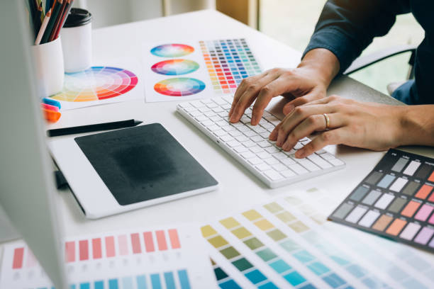 istock Freelance creative designers working on desk in modern home office. 1159364962