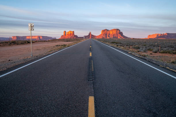 istock Monument valley view from highway road at sunset, Utah, USA 1159366544