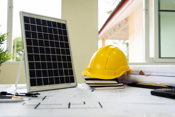 istock Desk of architects Solar Energy Powered Home Green for reduce global warming. 1159366567