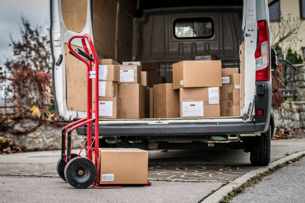 Parcels in delivery van Stack of cardboard boxes and parcels in delivery van. delivery van stock pictures, royalty-free photos & images