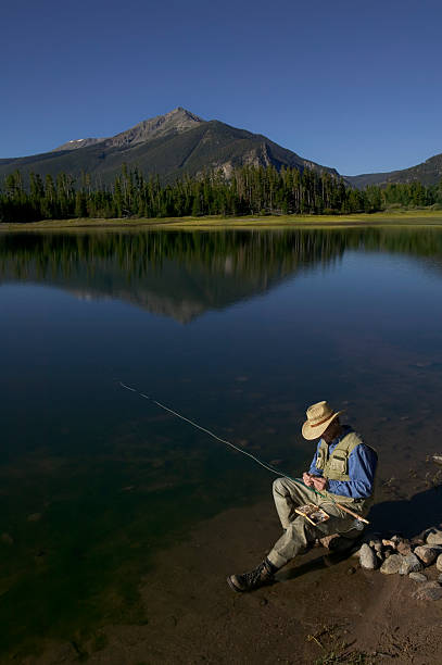 istock Fly Fishing in Mountain Lake 115936921