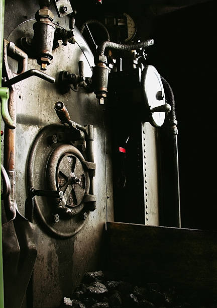 Interior of Steam Locomotive Cab The coal fueled firebox inside a historic cog train. firebox steam engine part stock pictures, royalty-free photos & images
