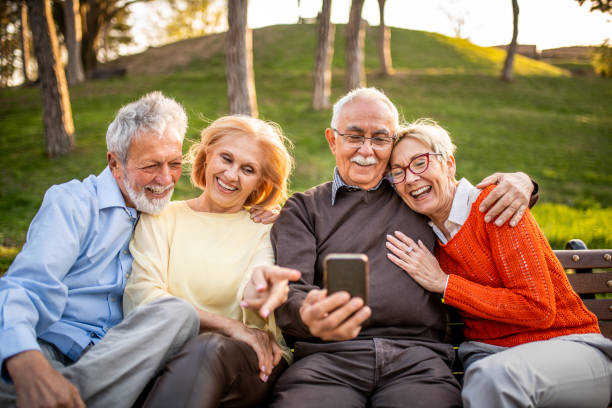 istock Group of seniors using mobile phone 1159371907