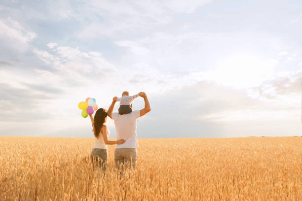 istock Parents and son having fun outdoors. Family time 1159372562