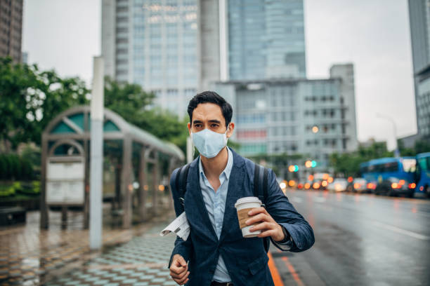 istock Businessman with pollution mask in Taipei 1159375066
