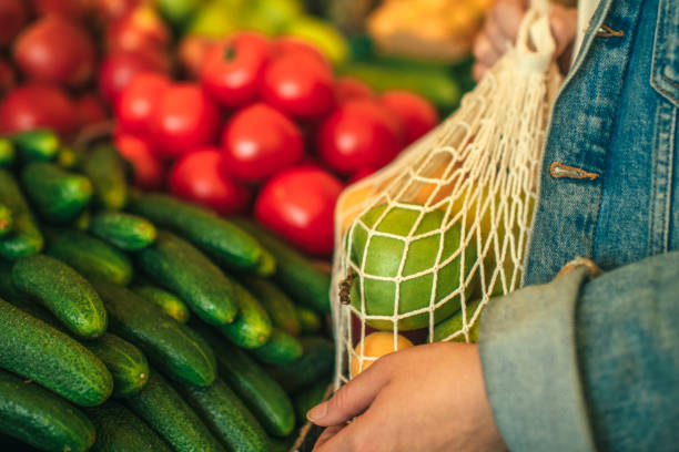 istock Vegetables and fruit in reusable bag on a farmers market, zero waste concept 1159376897