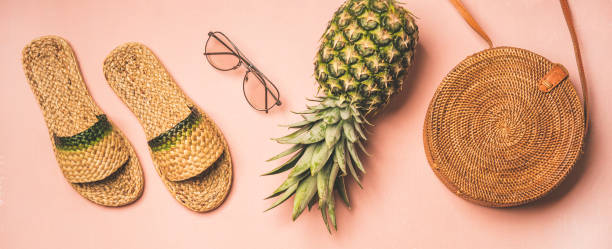 istock Summer apparel fashionable items over pastel background, wide composition 1159377755