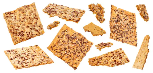 Crispbread with sesame, flax and sunflower grains isolated on white background with clipping path, collection