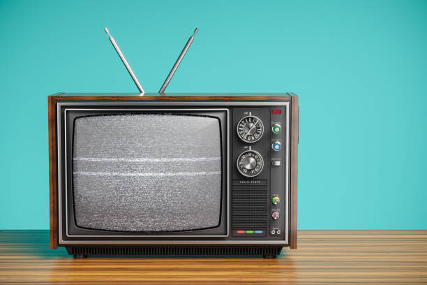 An old TV with a monochrome An old TV with a monochrome kinescope on wooden table. 3d old television stock pictures, royalty-free photos & images