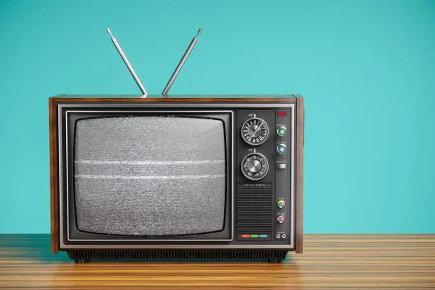 An old TV with a monochrome kinescope on wooden table. 3d