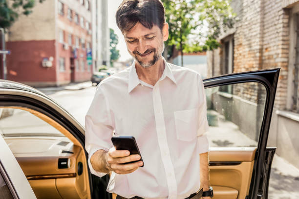 istock handsome businessman using his smartphone in the city 1159377904
