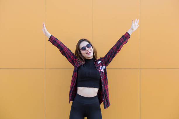 istock Happy girl with arms raised 1159377947