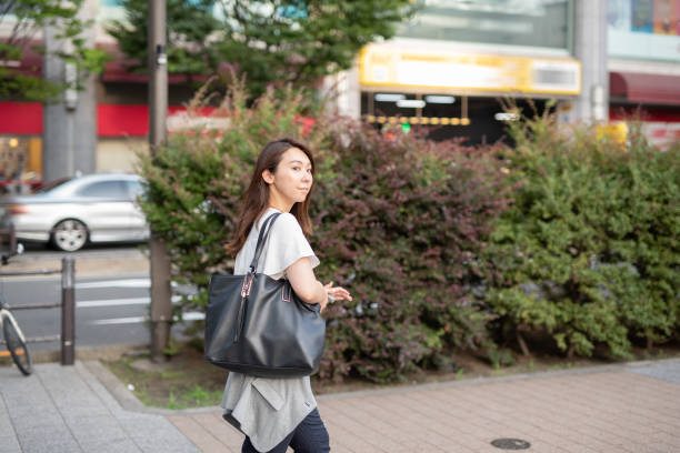 istock Commuting businesswoman 1159378139