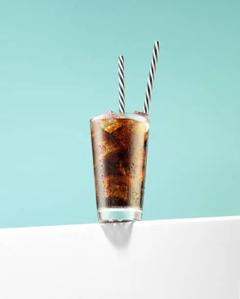 Photo of Soda Drink with Ice Cubes and Reusable Drinking Straws