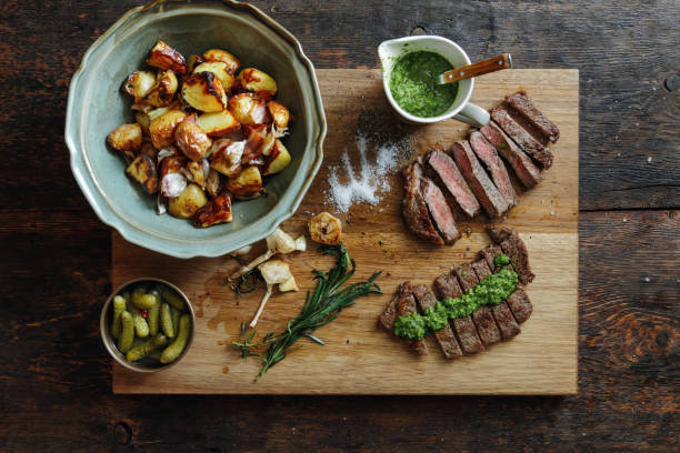 Kansas steak with fresh herb sauce and grilled vegetables Kansas steak with fresh herb sauce and grilled vegetables chimichurri stock pictures, royalty-free photos & images