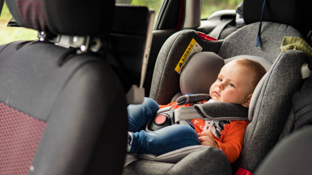 istock Baby sit in the car seat for safety. 1159380708
