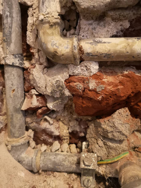 istock old waterpipes in the wall ready to be renewed 1159380726