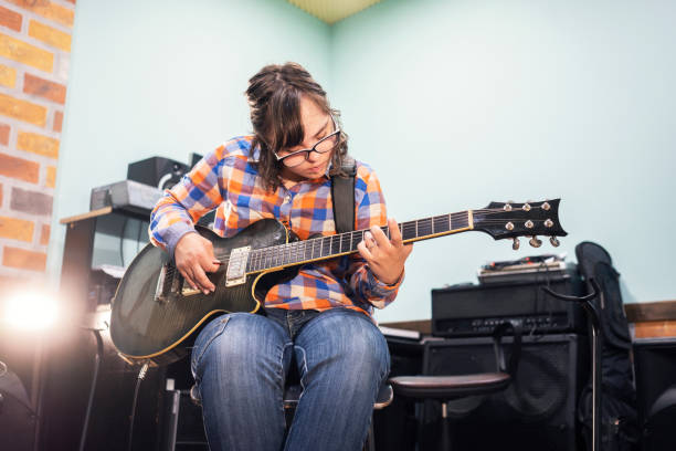 istock Who says that she can't play guitar 1159381619