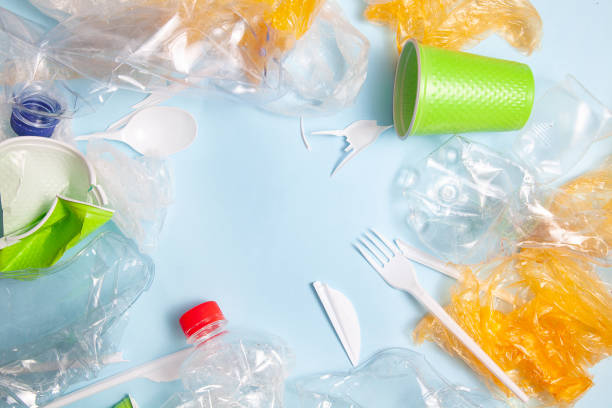 istock Recycling concept. ecology, environmental pollution. Background of crushed and crumpled plastic. Top view copy space. Blue background horizontal. ready Ban plastic. plastic pollution 1159381682