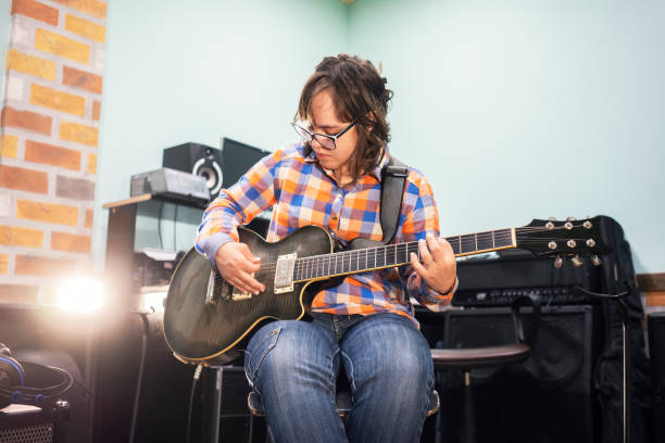istock Who says that she can't play guitar 1159381918