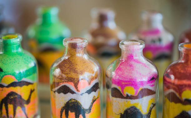 istock bottles with multicolor sand pictures inside 1159382924