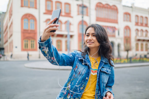 istock Happy tourist taking smartphone picture 1159385995