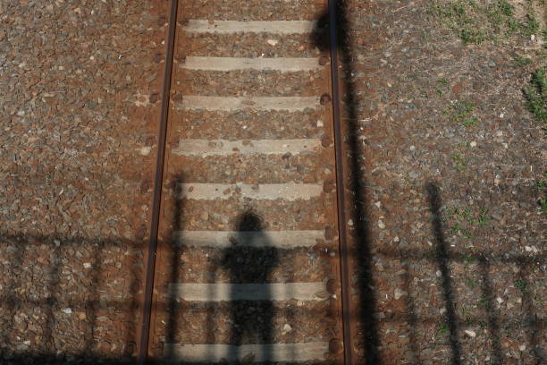My shadow on the railroad in the daytime