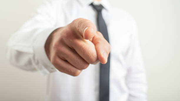 istock Male hand pointing index finger towards you 1159386261