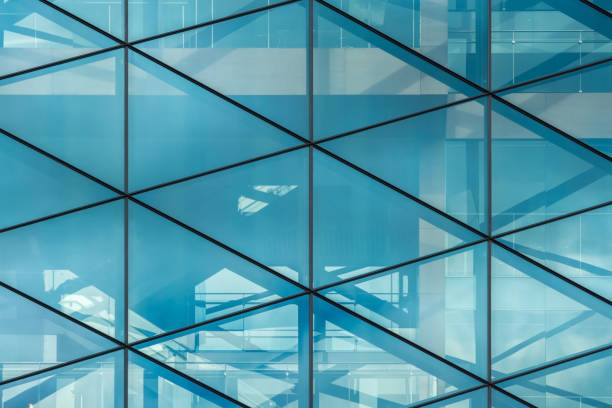 istock Glass wall with reflections in the office building 1159388940