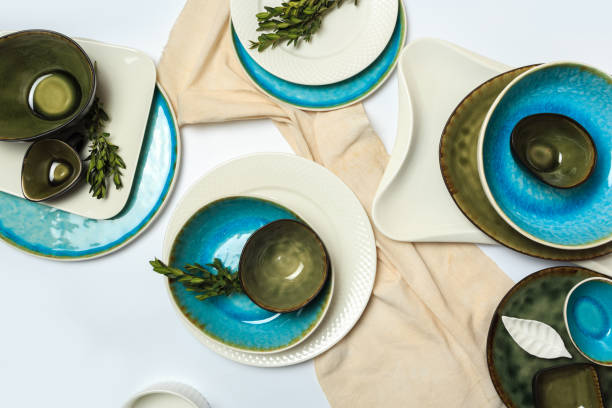 istock Simple rustic handmade blue crockery against white wooden wall: dish, stack of bowls. 1159391596